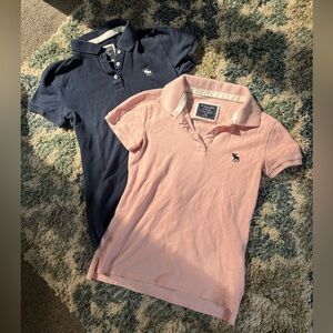 Two Abercrombie polo shirts pink and navy